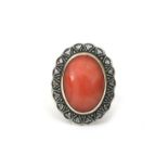 A 14 karat gold coral and diamond ring