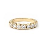 A 14 karat gold diamond half eternity band