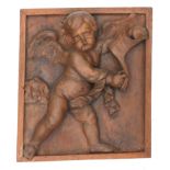 After Jérôme Duquesnoy II (1602-1654). A terracotta plaque of a putto in oak frame.