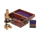 An achromatic messing microscope in mahogany case, probably France, circa 1900.