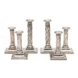 Set of six silver table candle sticks with twisted stem on square basement, J.M. van Kempen & Zonen,