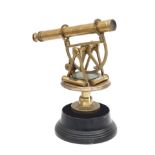 A brass theodolite telescope on wooden base, England, 19th century.