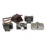 Four diverse cameras, including, amongst others, Vena Amsterdam and Zeiss Ikon.