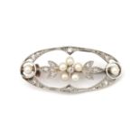 A gold Belle Epoque diamond and pearl brooch