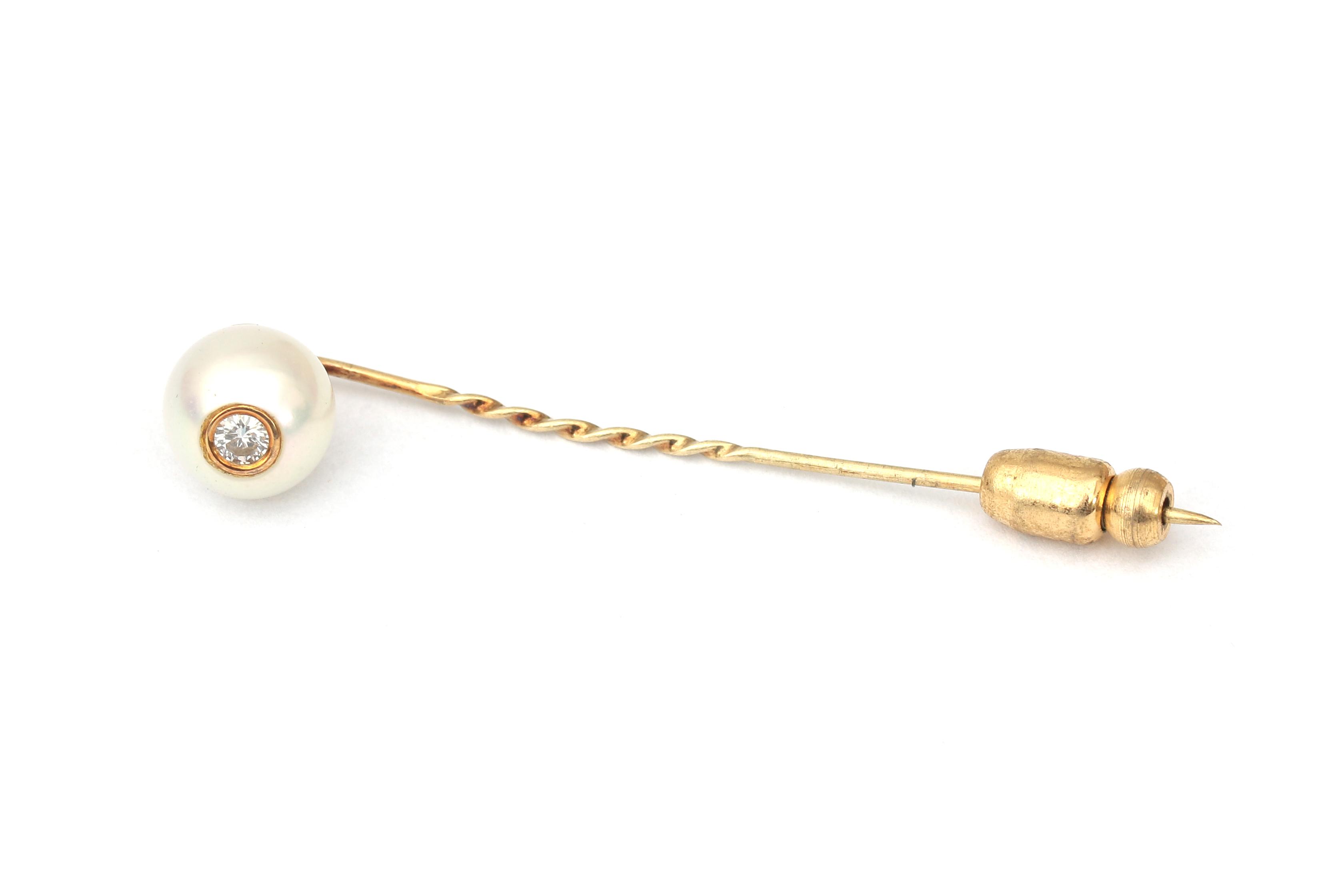 A gold pearl and diamond tie pin