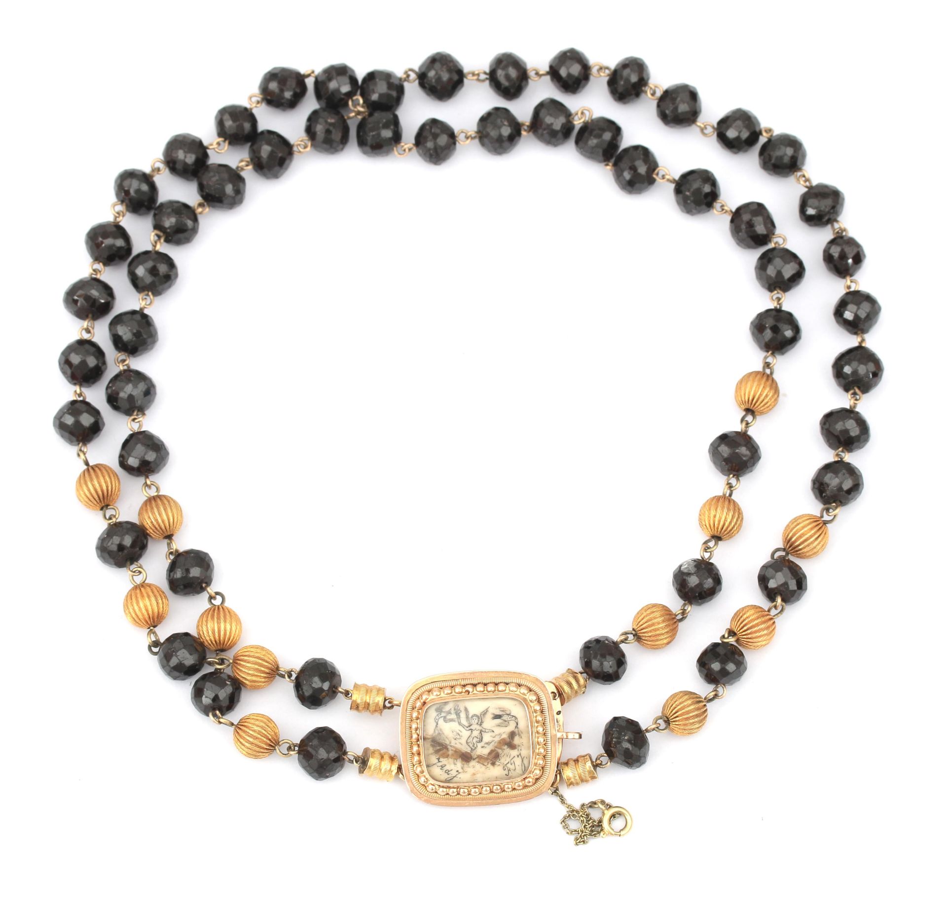 A garnet necklace with a 14 karat gold clasp