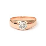 A 14 karat rose gold diamond gypsy ring