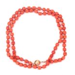 A precious coral bead necklace to a 14 karat gold clasp
