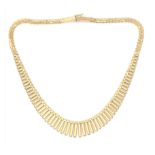A 14 karat gold fringe necklace