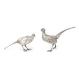 Two silver center pieces: pheasants.