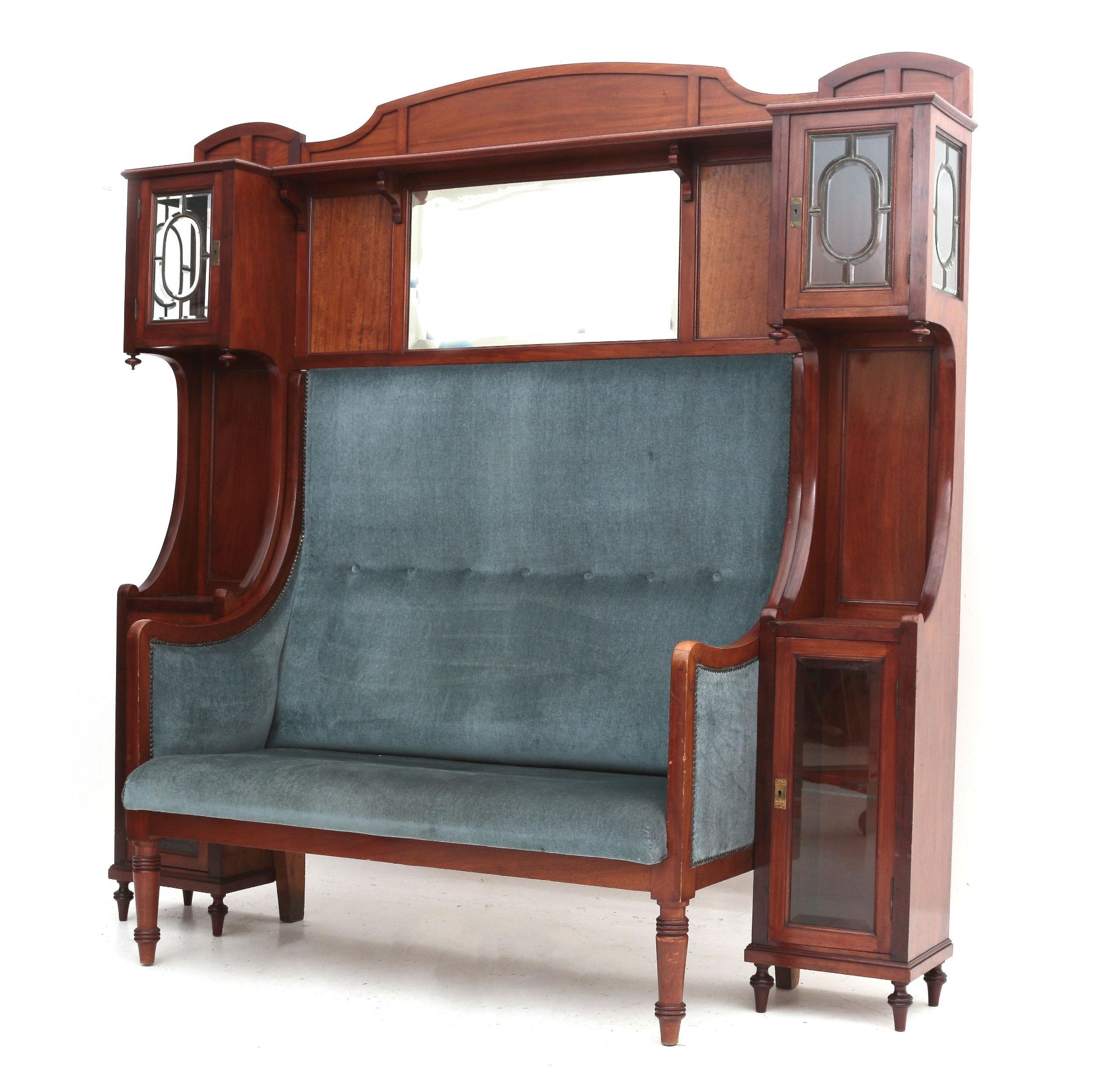 A mahogany sofa with integrated cupboard, Holland, circa 1910.