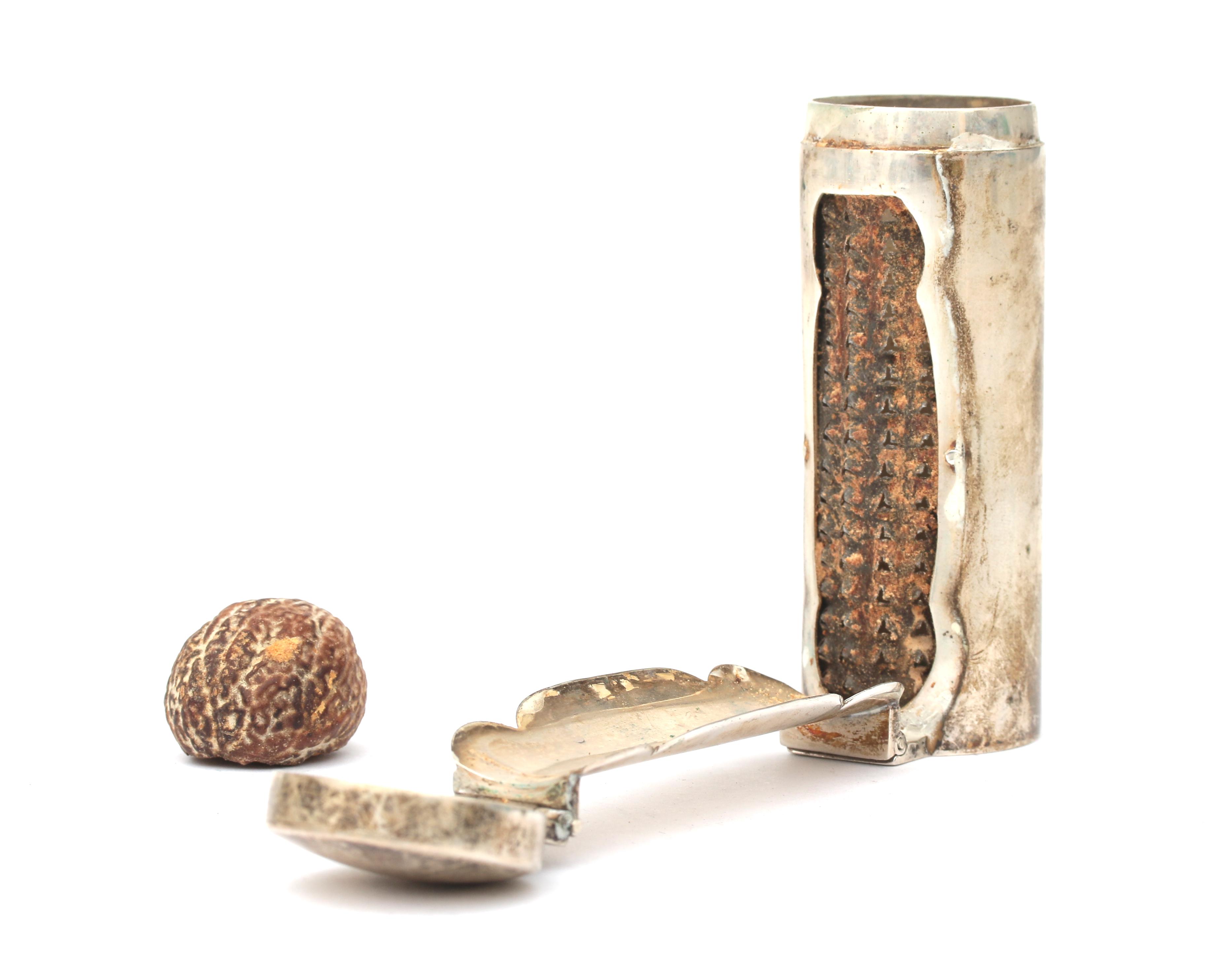 A silver nut meg grater.