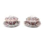 A pair of Japanese Imari bowls on saucers.