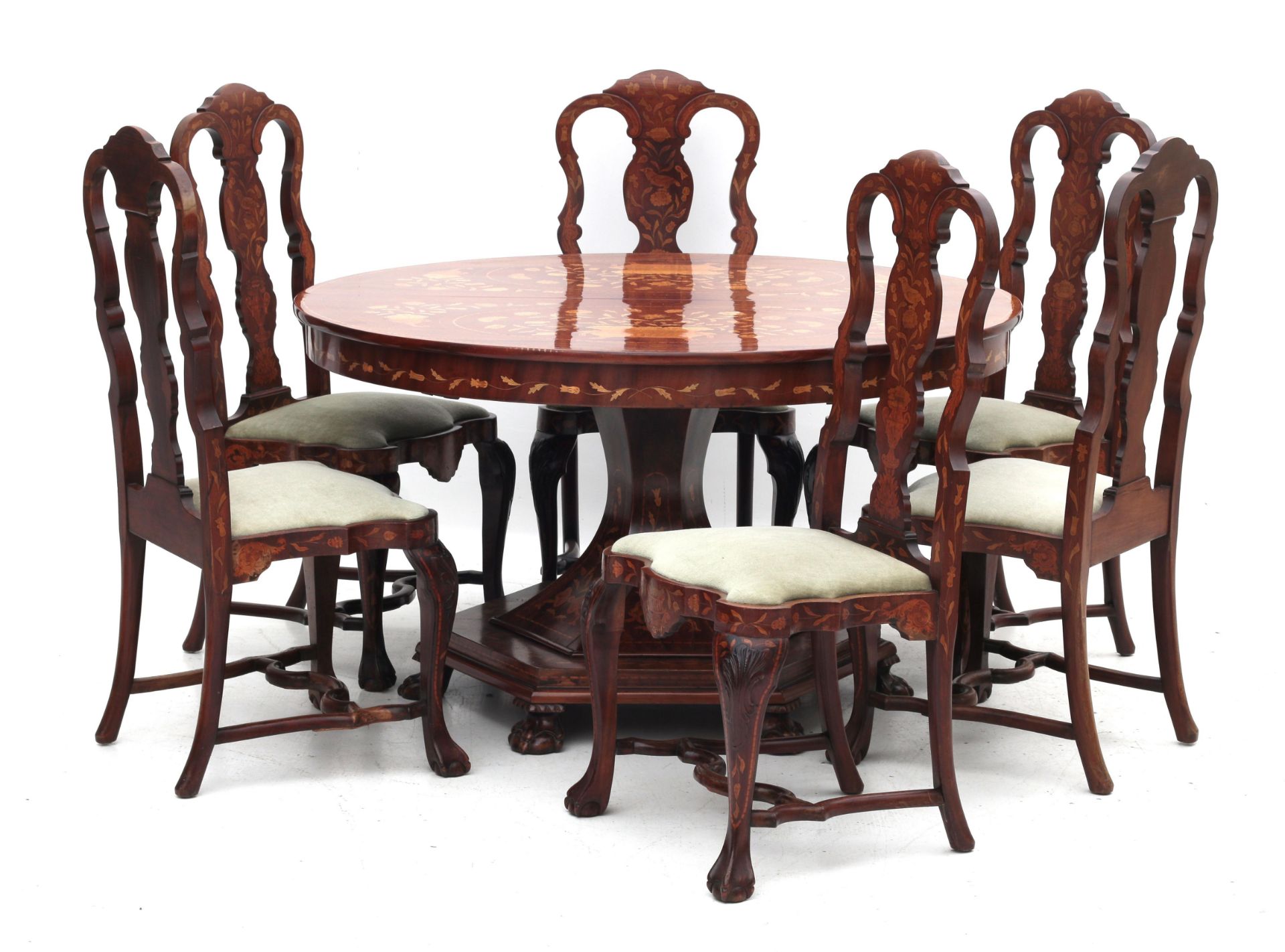 An inlaid extending dining table with six chairs.