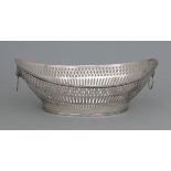 A pierced silver bread basket.