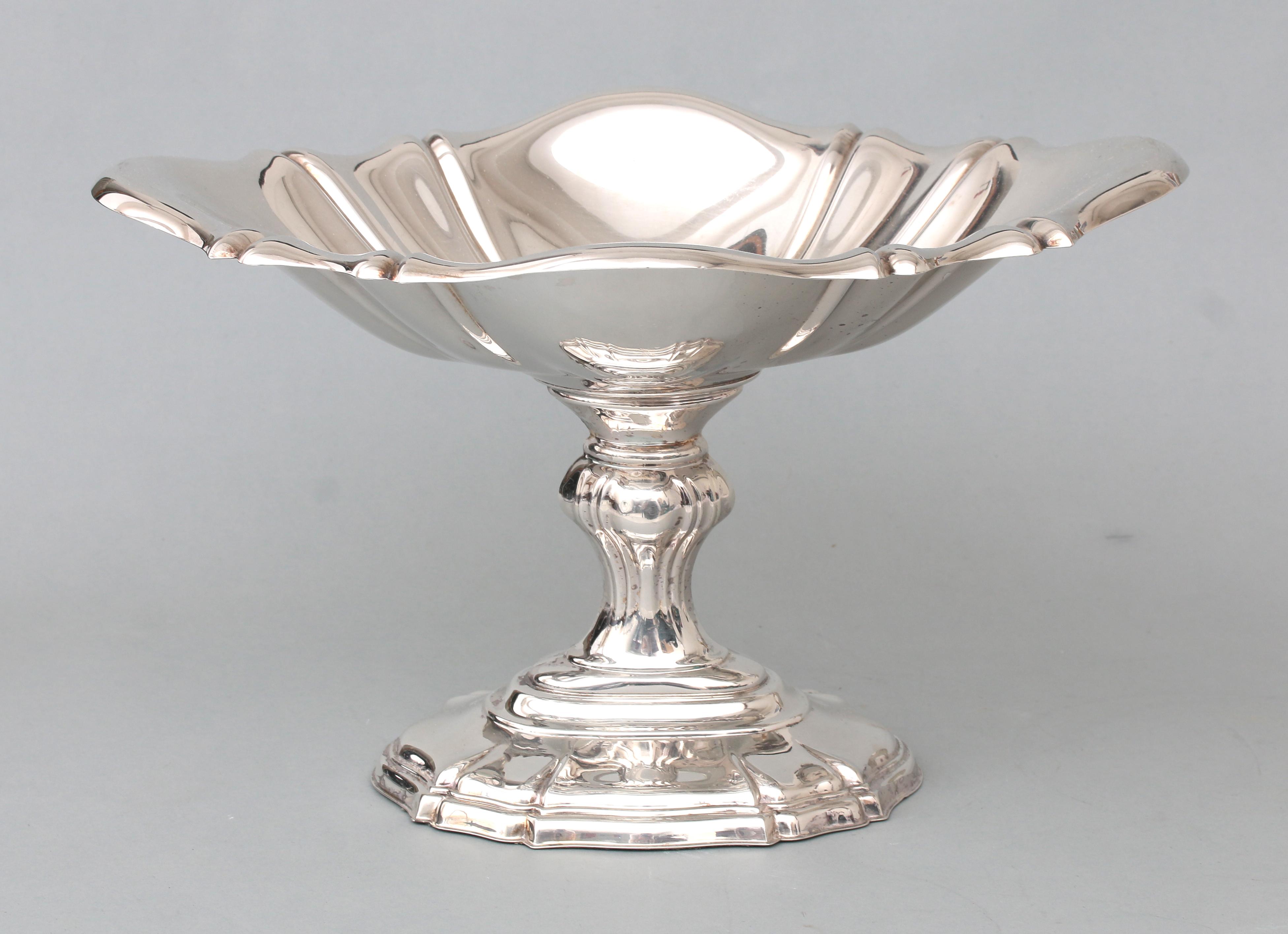 An oval silver dish on foot,