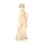 An ivory figurine of a woman, Meiji-period.