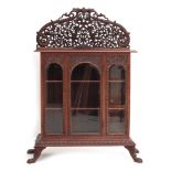 An Indonesian wooden display cabinet.