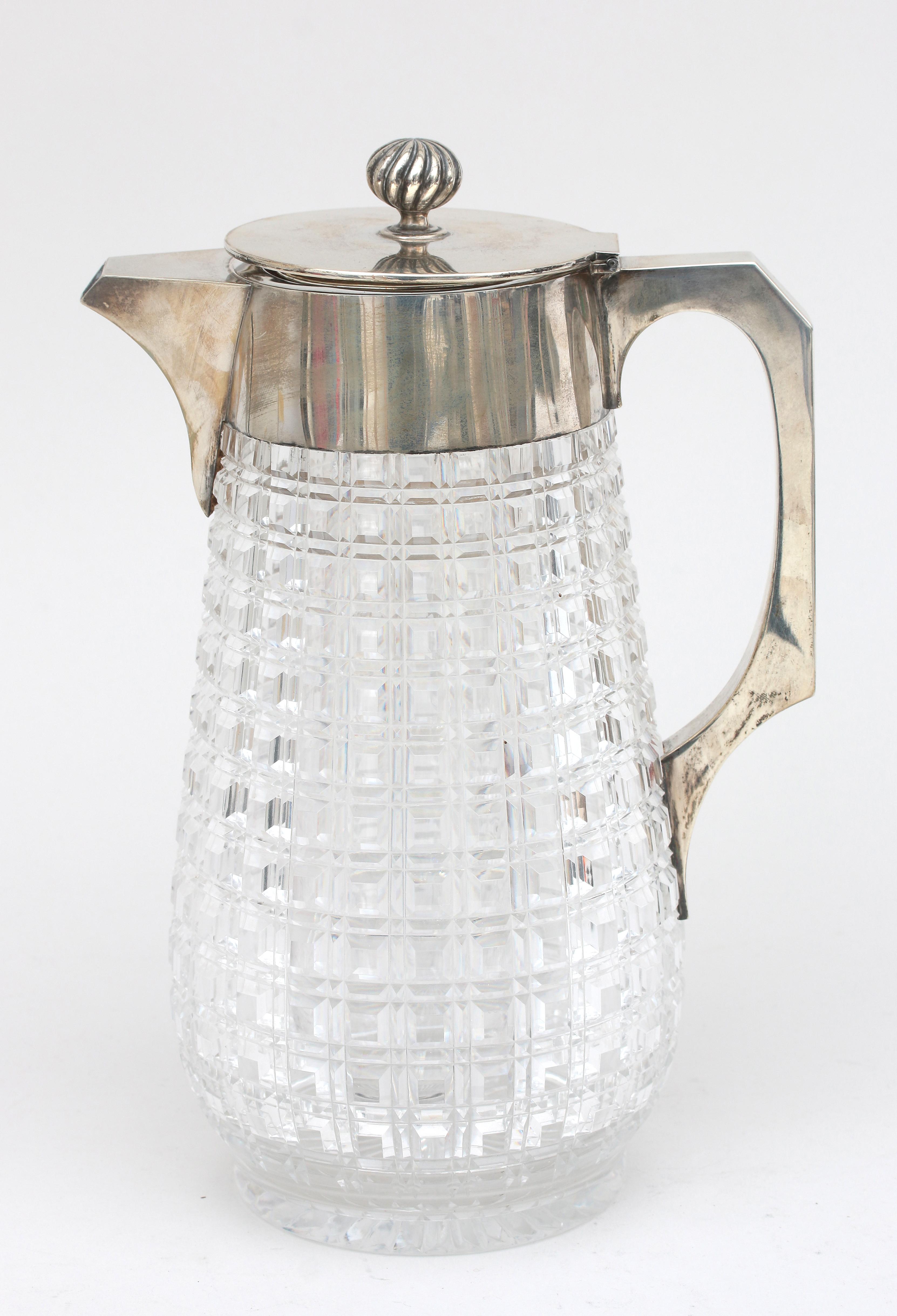 A cut crystal silver mounted jug, 1885.