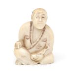 A carved ivory netsuke, circa 1900.