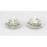 Two Japanese porcelain lidded cups and saucers.