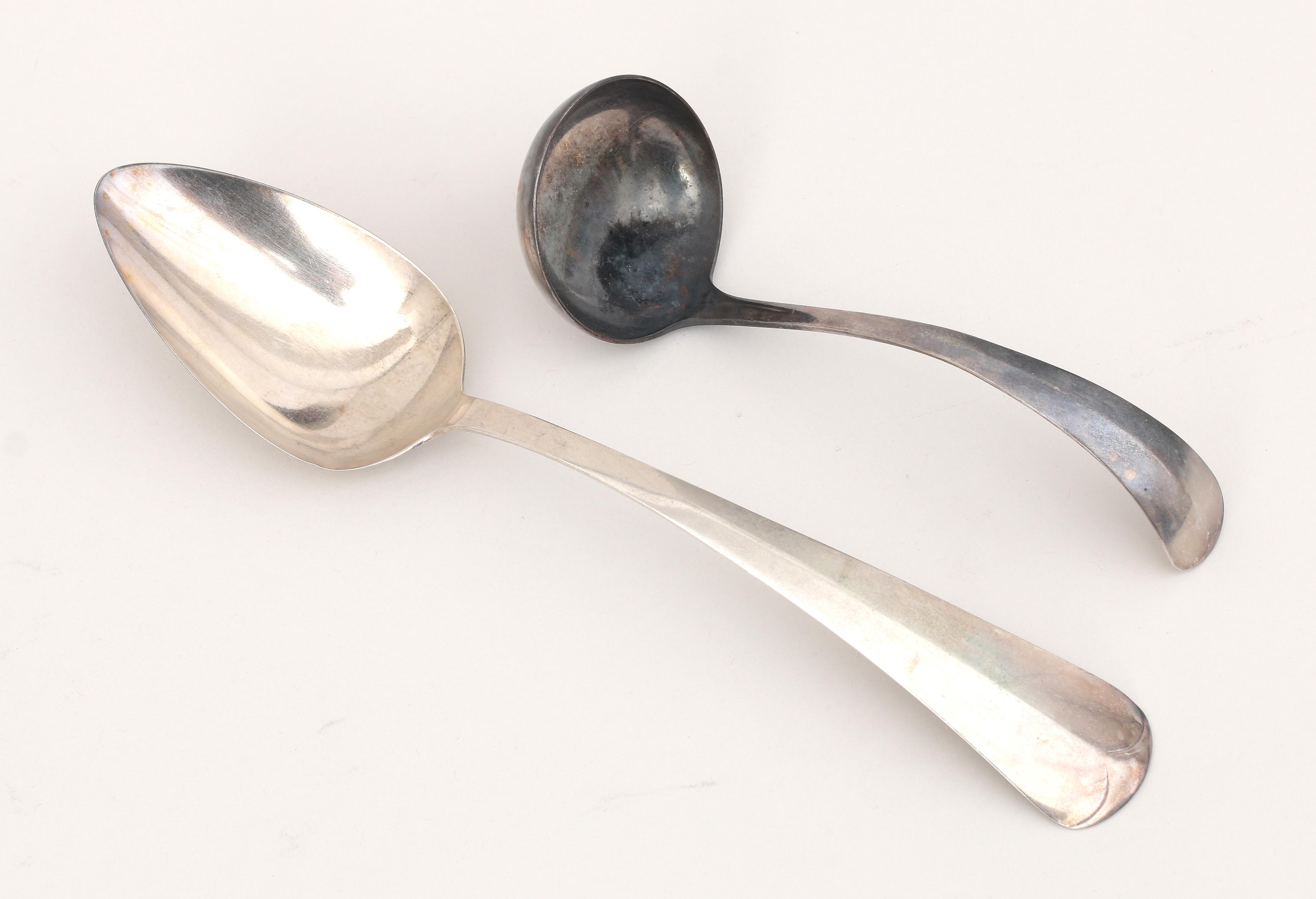 A Dutch silver sauce ladle and vegetable spoon.