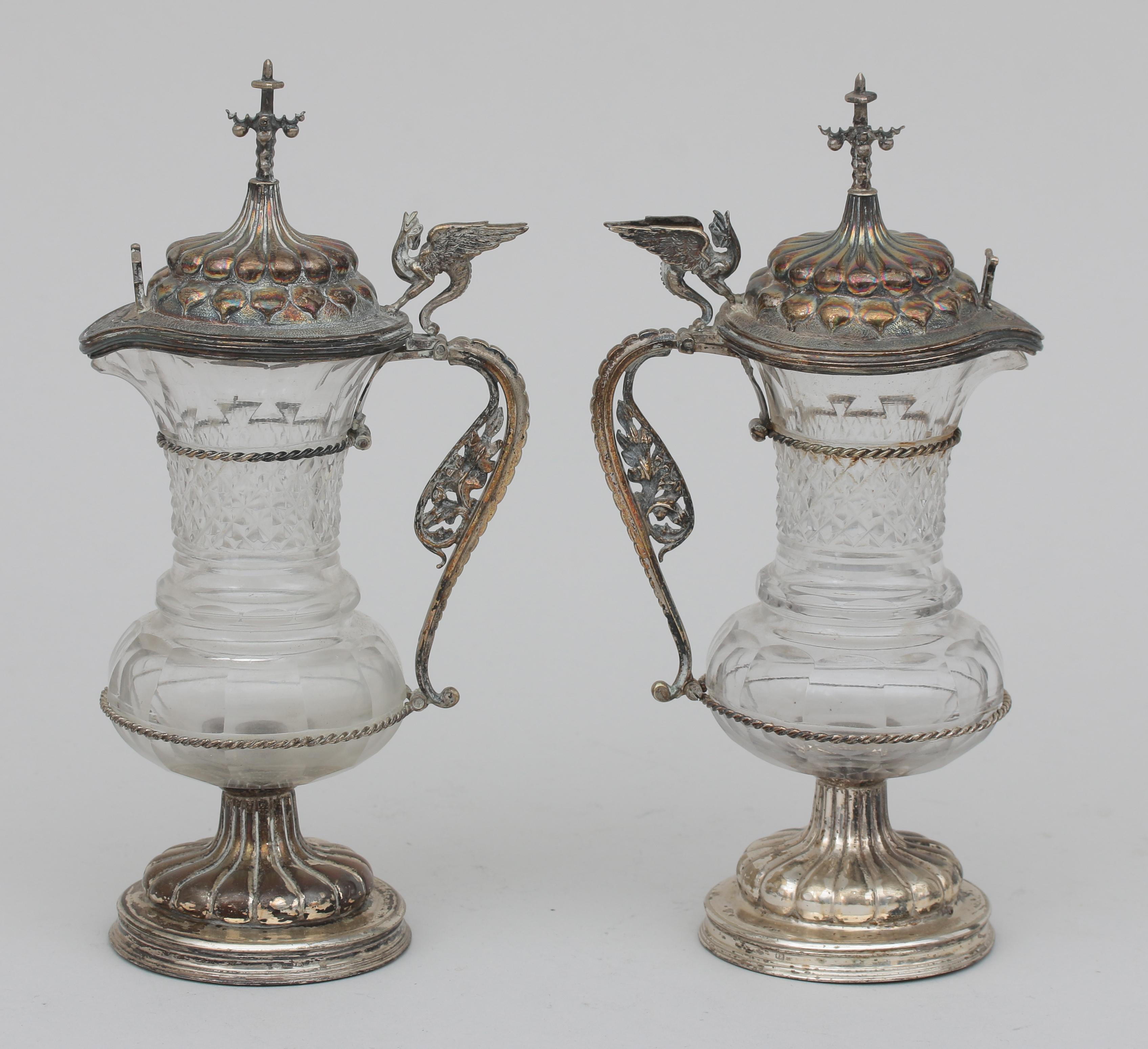 A pair of silver mounted cruet ampoules.