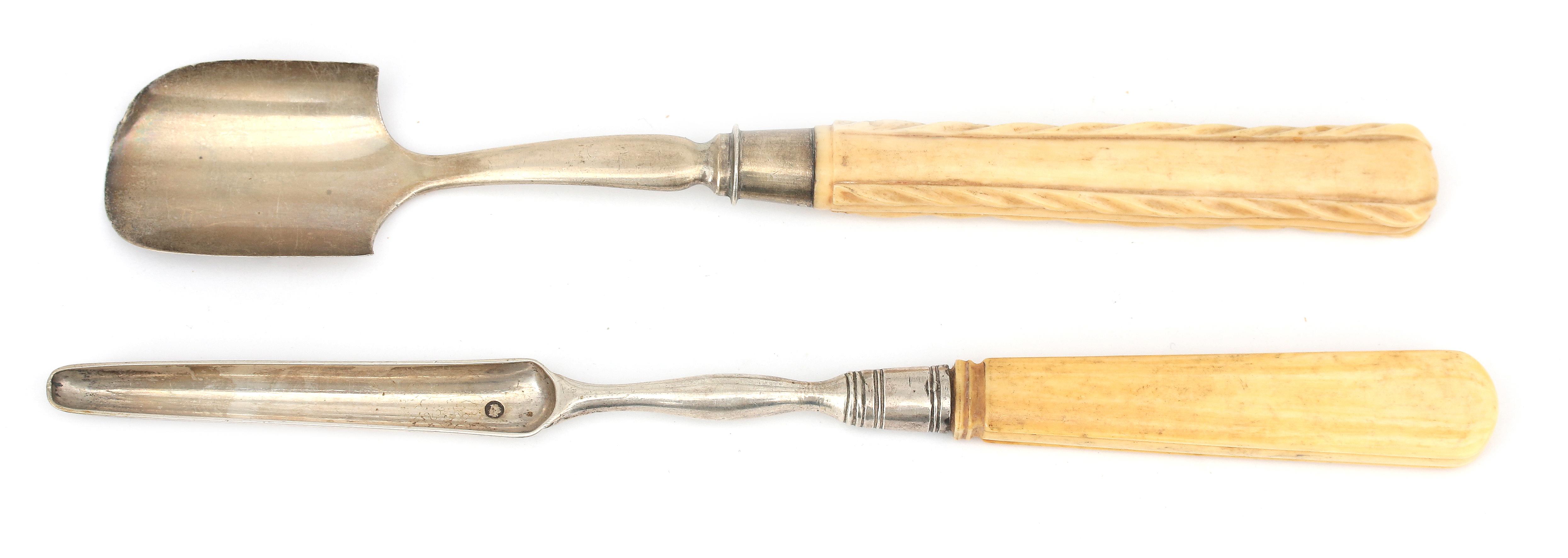A silver cheese scoop and marrow scoop.
