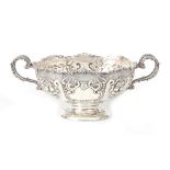 A large silver punch bowl on round foot.