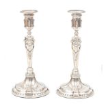 A pair of Louis Seize silver candle sticks.