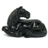 A Carved Black Stone Horse Sculpture