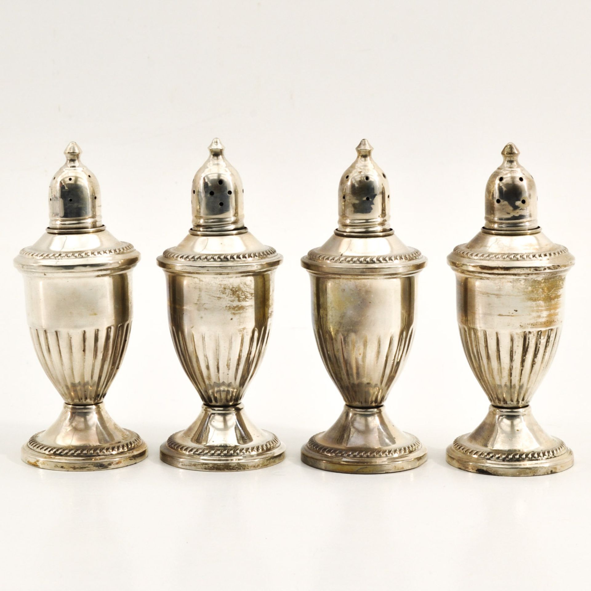 A Collection of 4 Silver Castors