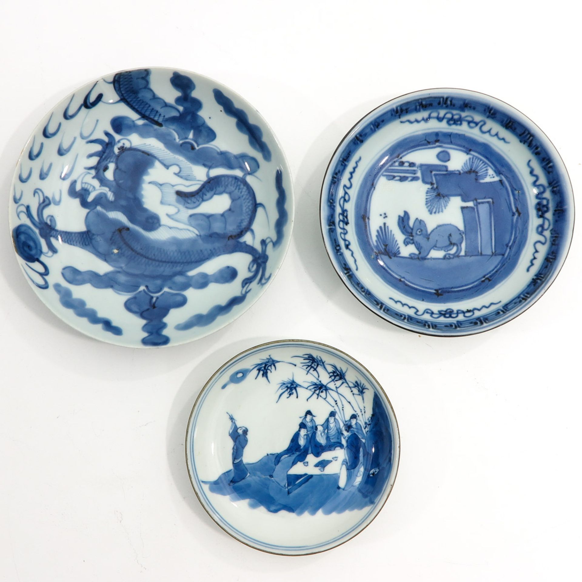 Three Small Blue and White Plates