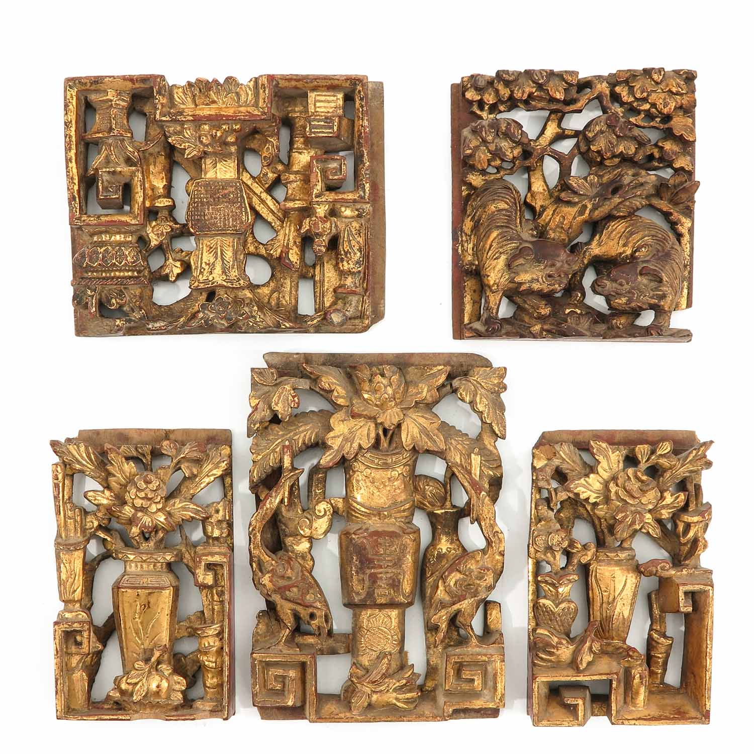 A Collection of Carved Wood Plaques