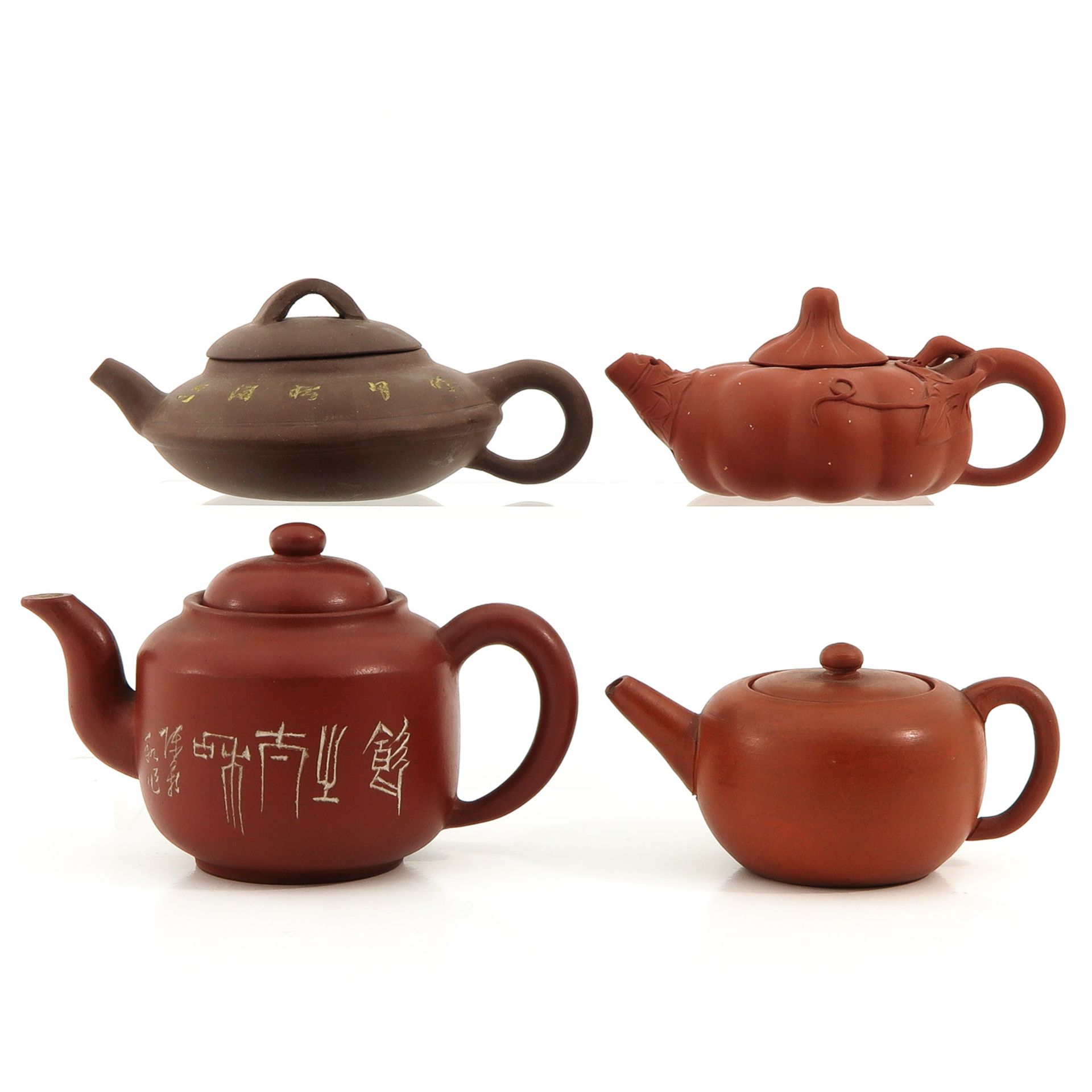 A Collection of 4 Yixing Teapots