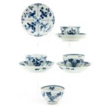 A Set of 4 Blue and White Cups and Saucers