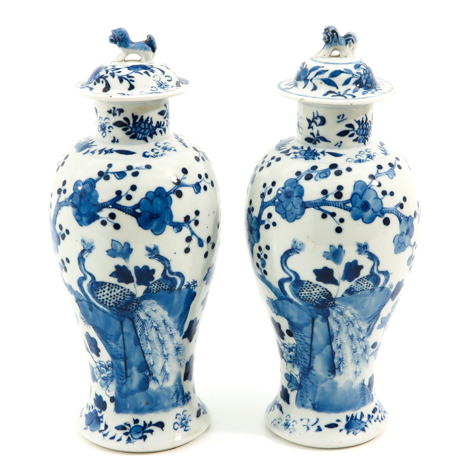 A Pair of Blue and White Covered Vases