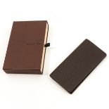 A Louis Vuitton Tiaga Leather Wallet