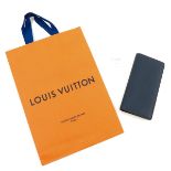 A Louis Vuitton Taiga Blue Leather Wallet