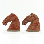 A Pair of Clay Trojan Horse Head Sculptures