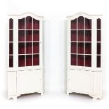 A Pair of White Painted Corner Cabinets
