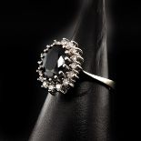 A Ladies 14KG Saphire and Diamond Ring