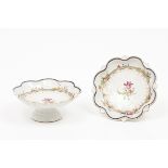 A pair of footed scalloped bowls