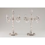 A pair of five branch candelabraPortuguese silver Profuse raised, engraved and chiselled decorat