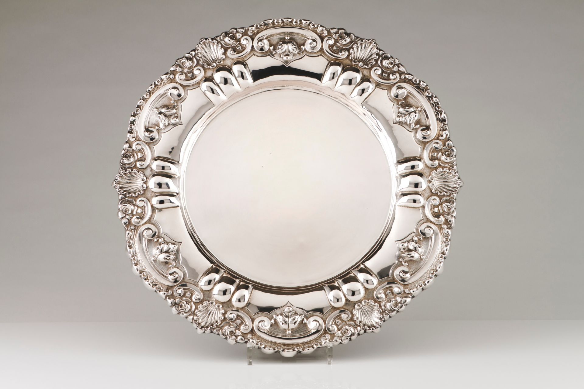 A large salverPortuguese silver Plain centre and wide lip of winglet, shell, floral and acanthus