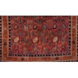 A Malayer rug, IranWool and cotton Floral pattern in red, blue and beige shades (signs of wear)<
