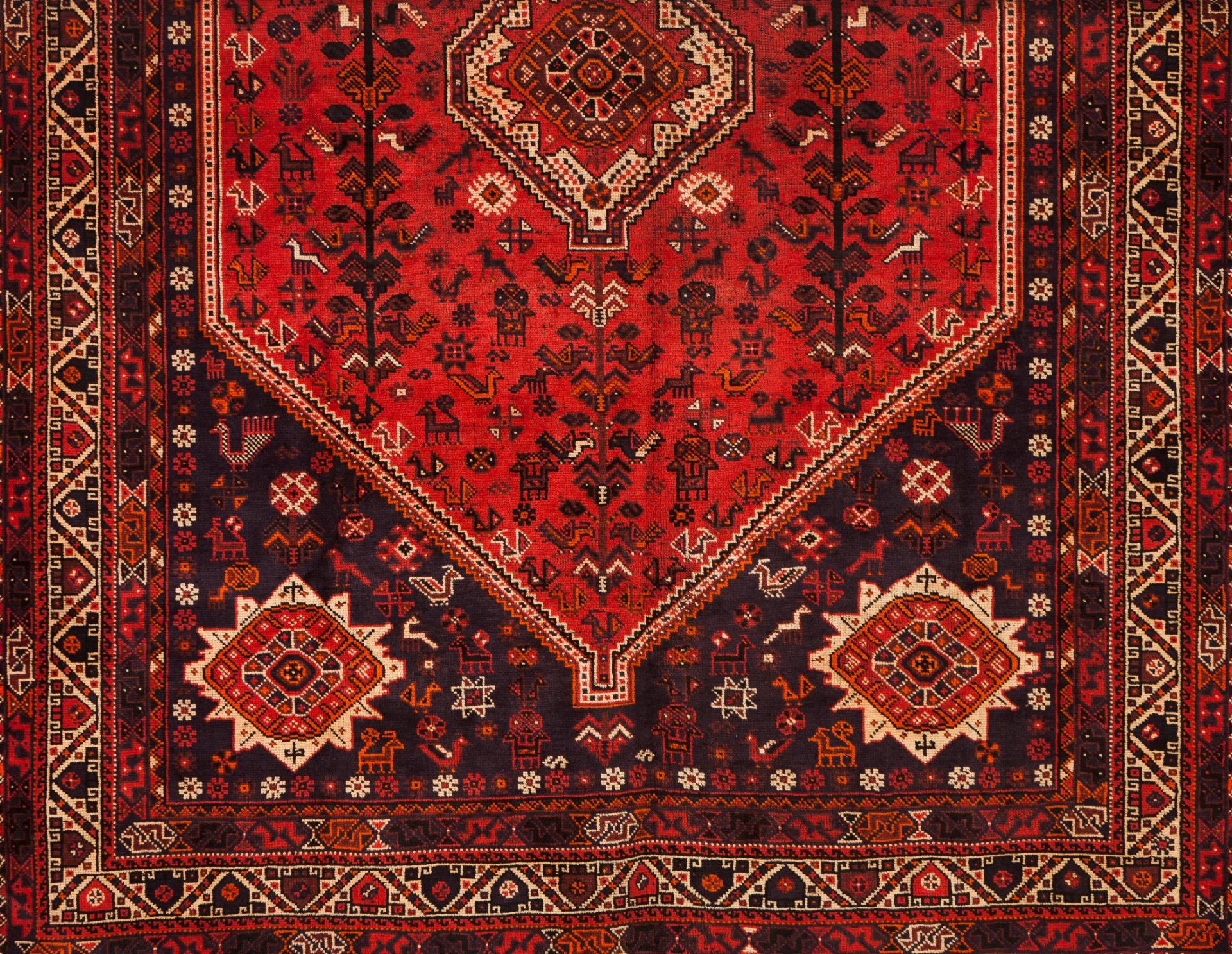A Shiraz rug, IranWool and cotton of geometric pattern in bordeaux and beige shades305x2