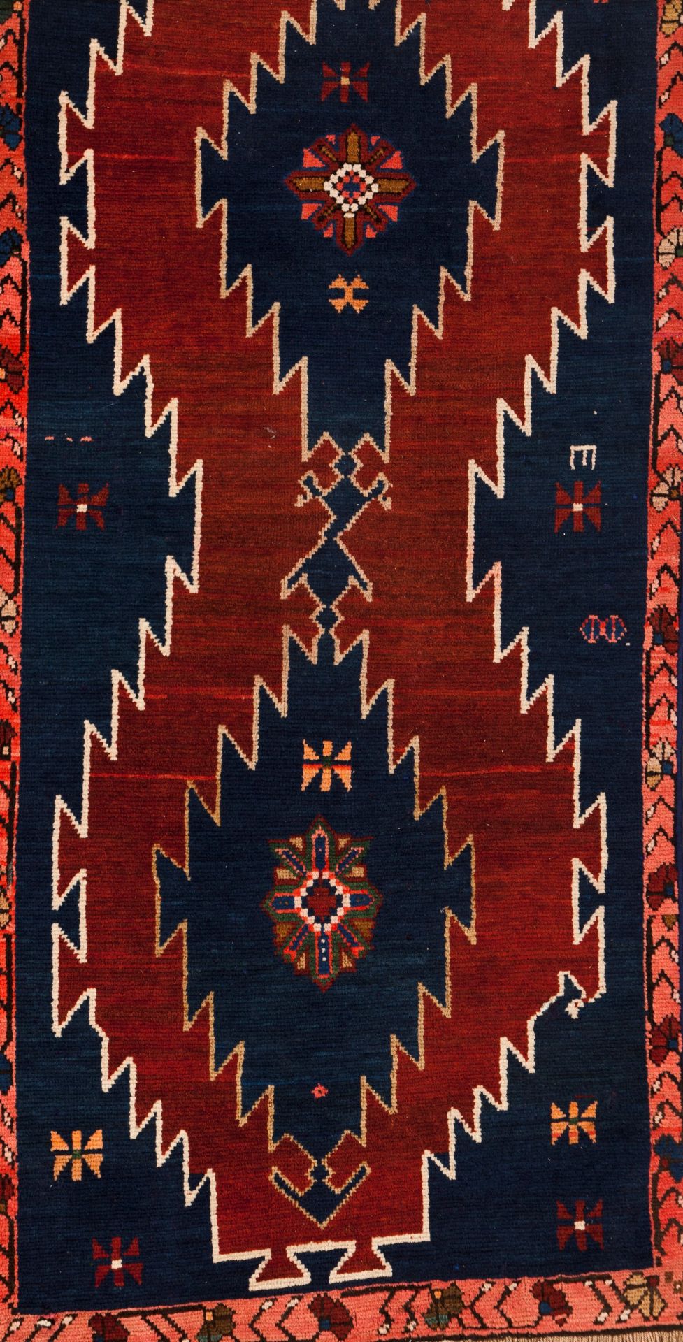 A Kazak rug, RussiaWool and cotton of geometric pattern in blue, salmon and beige shades