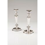 A pair of candlestandsPortuguese silver, 19th century Neoclassical decoration, turned shaft with