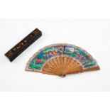 A hand fan in its case